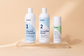 Three bottles of Benova products on a peach background