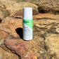 Benova Pain & Itch Relief Lotion on a rocky surface